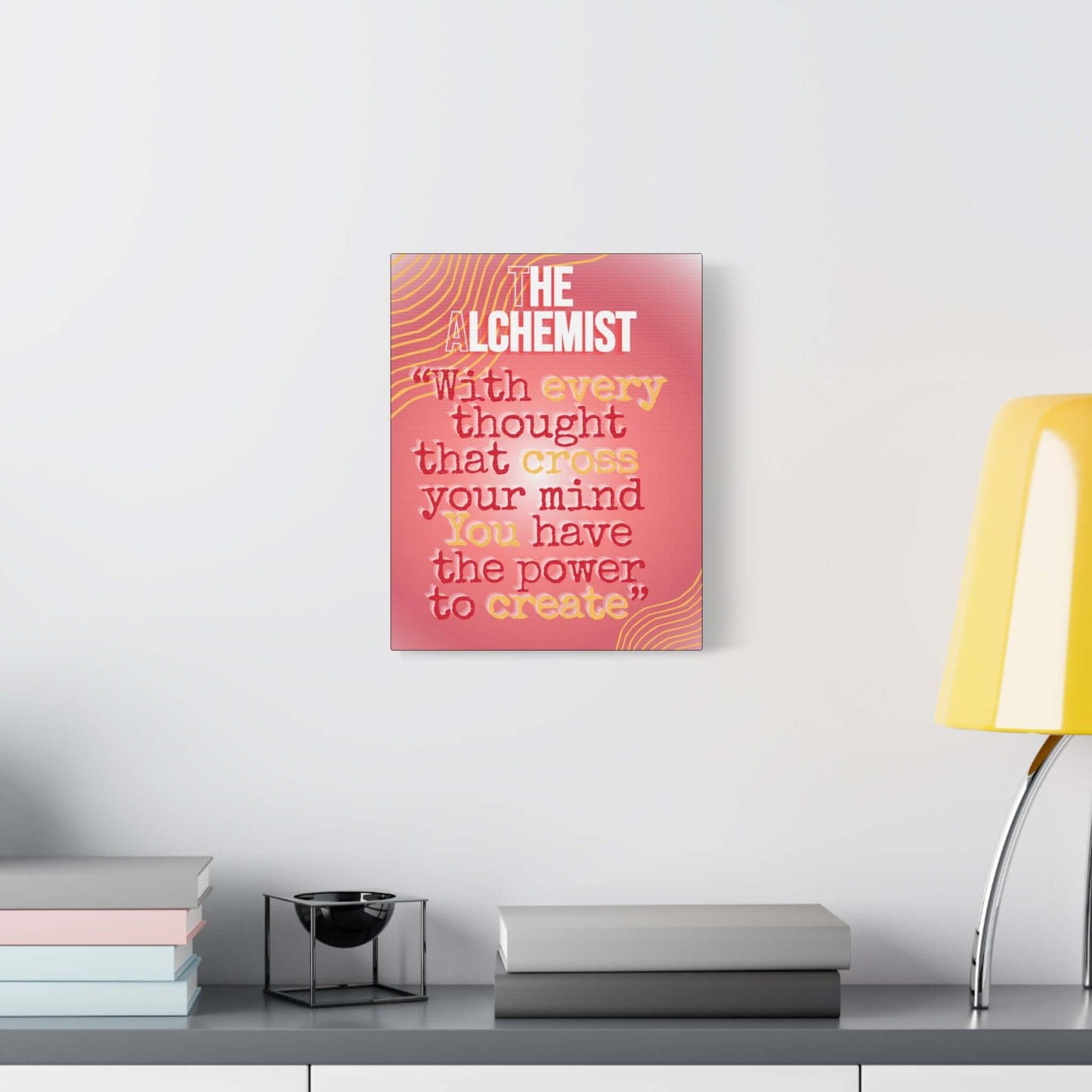 Alchemist quote canvas wall art featuring a sunset-pink gradient and motivational text in a modern setting.